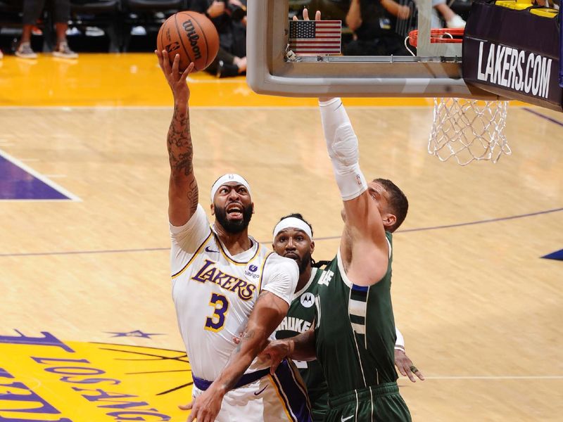 LOS ANGELES, CA - OCTOBER 15: Anthony Davis #3 of the Los Angeles Lakers drives to the basket during the game against the Milwaukee Bucks on October 15, 2023 at Crypto.Com Arena in Los Angeles, California. NOTE TO USER: User expressly acknowledges and agrees that, by downloading and/or using this Photograph, user is consenting to the terms and conditions of the Getty Images License Agreement. Mandatory Copyright Notice: Copyright 2023 NBAE (Photo by Adam Pantozzi/NBAE via Getty Images)