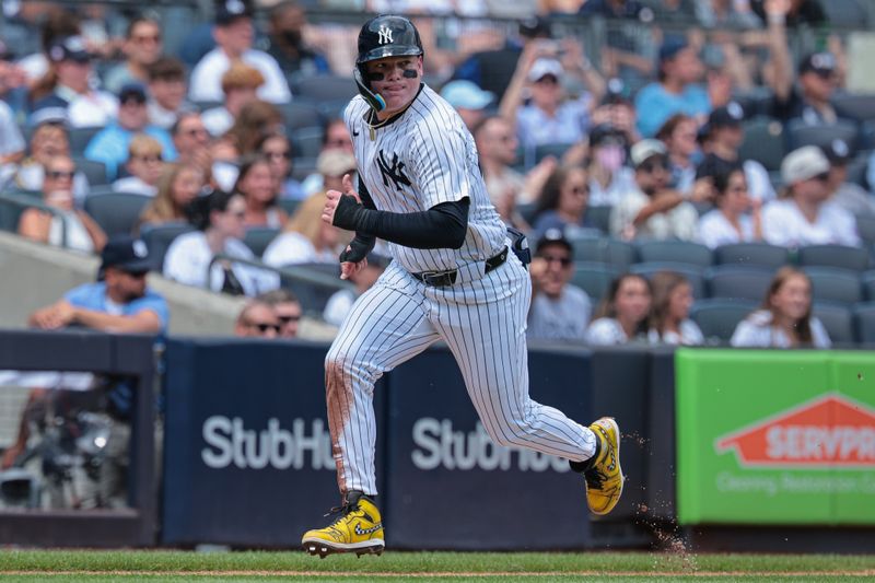 Aug 11, 2024; Bronx, New York, USA; New York Yankees left fielder Alex Verdugo (24) scores a run on a sacrifice fly by designated hitter Giancarlo Stanton (not pictured) during the first inning against the Texas Rangers at Yankee Stadium. Mandatory Credit: Vincent Carchietta-USA TODAY Sports