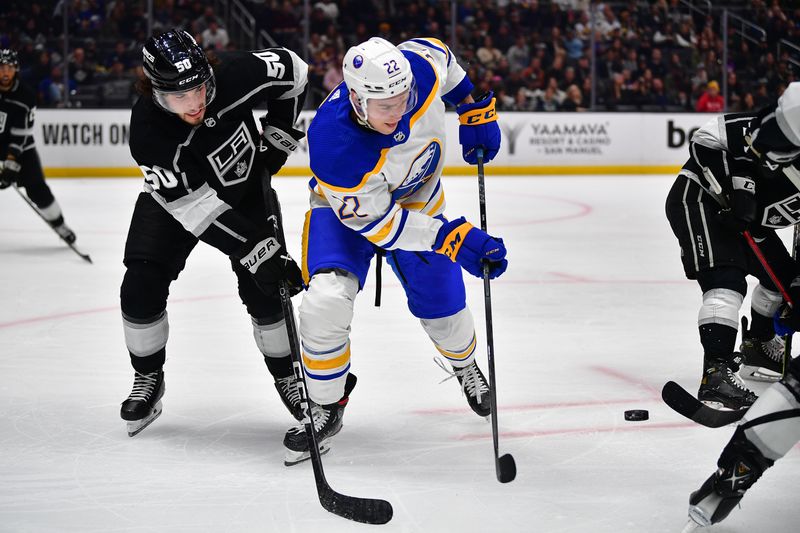 Feb 13, 2023; Los Angeles, California, USA; Buffalo Sabres right wing Jack Quinn (22) plays for the puck against Los Angeles Kings defenseman Sean Durzi (50) during the third period at Crypto.com Arena. Mandatory Credit: Gary A. Vasquez-USA TODAY Sports