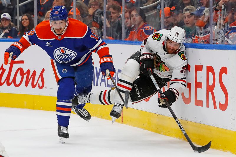 Oct 12, 2024; Edmonton, Alberta, CAN; Edmonton Oilers forward Zach Hyman (18) checks Chicago Blackhawks defensemen TJ Brodie (78) during the first period at Rogers Place. Mandatory Credit: Perry Nelson-Imagn Images