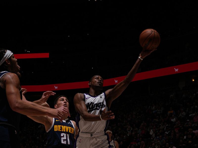 DENVER, CO - FEBRUARY 14: De'Aaron Fox #5 of the Sacramento Kings drives to the basket during the game against the Denver Nuggets on February 14, 2024 at the Ball Arena in Denver, Colorado. NOTE TO USER: User expressly acknowledges and agrees that, by downloading and/or using this Photograph, user is consenting to the terms and conditions of the Getty Images License Agreement. Mandatory Copyright Notice: Copyright 2024 NBAE (Photo by Bart Young/NBAE via Getty Images)