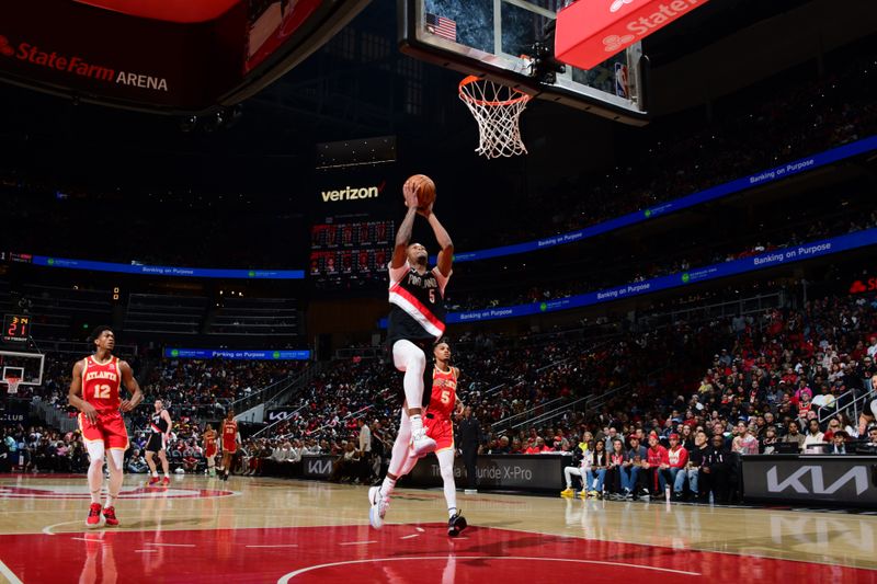 ATLANTA, GA - MARCH 3: Cam Reddish #5 of the Portland Trail Blazers drives to the basket during the game against the Atlanta Hawks on March 3, 2023 at State Farm Arena in Atlanta, Georgia.  NOTE TO USER: User expressly acknowledges and agrees that, by downloading and/or using this Photograph, user is consenting to the terms and conditions of the Getty Images License Agreement. Mandatory Copyright Notice: Copyright 2023 NBAE (Photo by Scott Cunningham/NBAE via Getty Images)