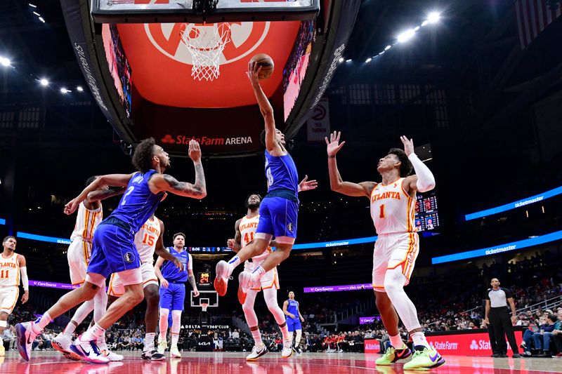 ATLANTA, GA - JANUARY 26: Josh Green #8 of the Dallas Mavericks rebounds during the game against the Atlanta Hawks on January 26, 2024 at State Farm Arena in Atlanta, Georgia.  NOTE TO USER: User expressly acknowledges and agrees that, by downloading and/or using this Photograph, user is consenting to the terms and conditions of the Getty Images License Agreement. Mandatory Copyright Notice: Copyright 2024 NBAE (Photo by Adam Hagy/NBAE via Getty Images)