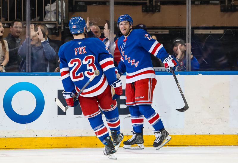 Mar 22, 2025; New York, New York, USA; New York Rangers center Jonny Brodzinski (22) celebrates his second goal of the game against the Vancouver Canucks during the third period at Madison Square Garden. Mandatory Credit: Danny Wild-Imagn Images