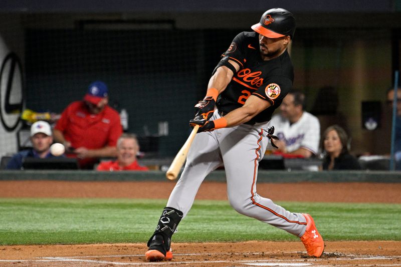 Oct 10, 2023; Arlington, Texas, USA; Baltimore Orioles right fielder Anthony Santander (25) hits a single in the first inning against the Texas Rangers during game three of the ALDS for the 2023 MLB playoffs at Globe Life Field. Mandatory Credit: Jerome Miron-USA TODAY Sports