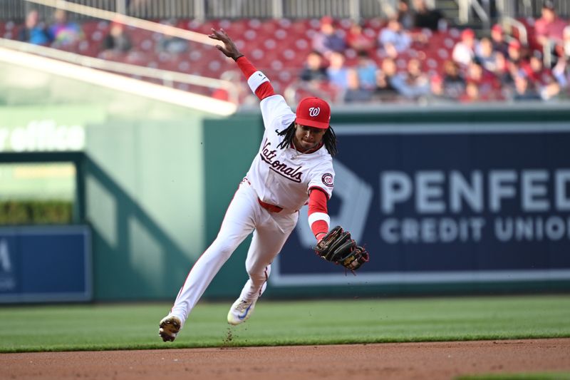 May 20, 2024; Washington, District of Columbia, USA; Washington Nationals shortstop CJ Abrams (5) fields a ground ball against the Minnesota Twins during the first inning at Nationals Park. Mandatory Credit: Rafael Suanes-USA TODAY Sports