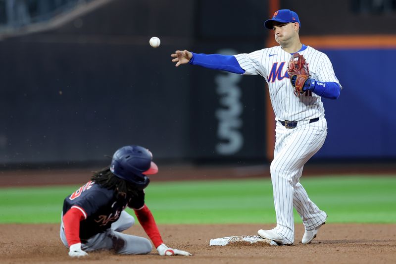 Sep 18, 2024; New York City, New York, USA; New York Mets second baseman Jose Iglesias (11) forces out Washington Nationals shortstop CJ Abrams (5) at second and throws to first to complete a double play on a ball hit by Nationals right fielder Dylan Crews (not pictured) during the third inning at Citi Field. Mandatory Credit: Brad Penner-Imagn Images