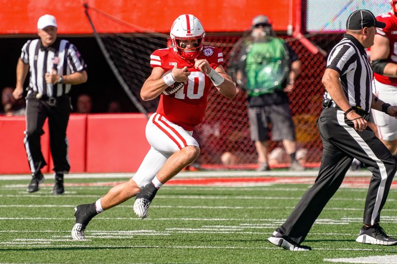 Sep 30, 2023; Lincoln, Nebraska, USA; Nebraska Cornhuskers quarterback Heinrich Haarberg (10) runs against the Michigan Wolverines during the second quarter at Memorial Stadium. Mandatory Credit: Dylan Widger-USA TODAY Sports