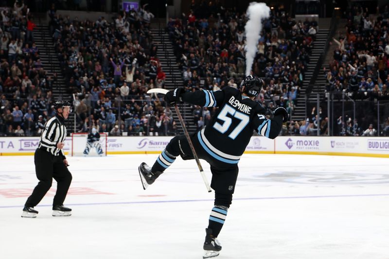 Nov 22, 2025; Salt Lake City, Utah, USA; Utah Mammoth defenseman Nick Desimone (57) celebrates a goal against the New York Rangers during the third period at Delta Center. Mandatory Credit: Rob Gray-Imagn Images