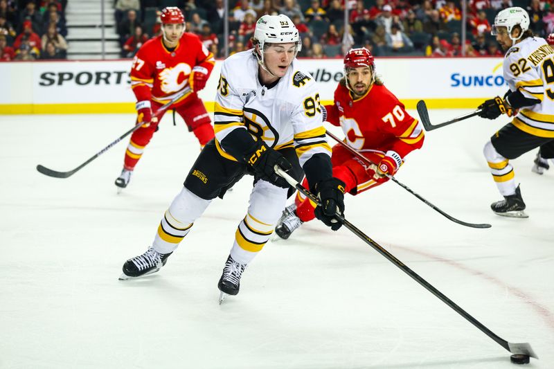 Dec 29, 2025; Calgary, Alberta, CAN; Boston Bruins center Fraser Minten (93) controls the puck against the Calgary Flames during the first period at Scotiabank Saddledome. Mandatory Credit: Sergei Belski-Imagn Images