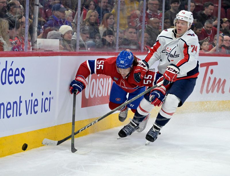 Feb 17, 2024; Montreal, Quebec, CAN; Montreal Canadiens forward Michael Pezzetta (55) and Washington Capitals defenseman John Carlson (74) battle for the puck during the second period at the Bell Centre. Mandatory Credit: Eric Bolte-USA TODAY Sports