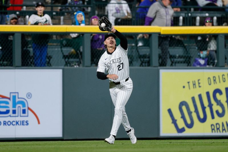 May 10, 2024; Denver, Colorado, USA; Colorado Rockies left fielder Jordan Beck (27) makes a catch for an out in the ninth inning against the Texas Rangers at Coors Field. Mandatory Credit: Isaiah J. Downing-USA TODAY Sports