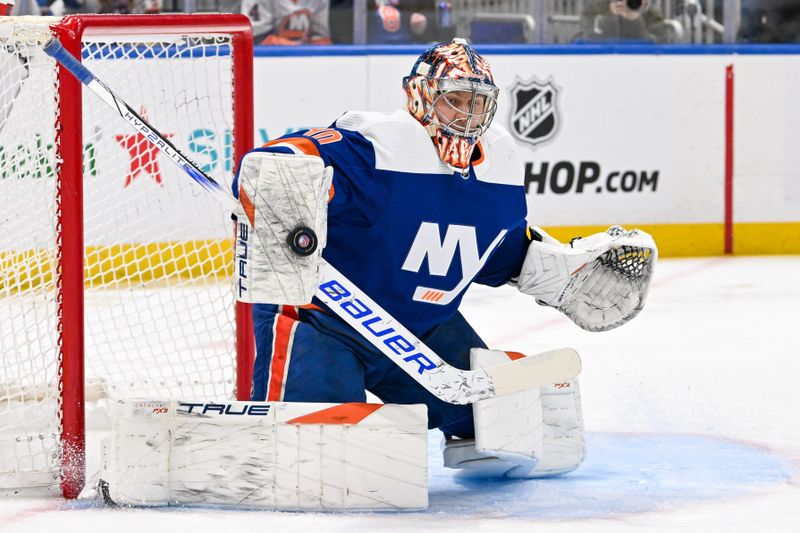 Jan 27, 2024; Elmont, New York, USA; New York Islanders goaltender Semyon Varlamov (40) makes a save against the Florida Panthers during the first period at UBS Arena. Mandatory Credit: Dennis Schneidler-USA TODAY Sports