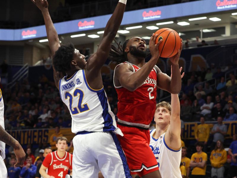 Nov 28, 2025; Pittsburgh, Pennsylvania, USA;  Ohio State Buckeyes guard Bruce Thornton (2) goes to the basket between Pittsburgh Panthers guard Barry Dunning Jr. (22) and guard Nojus Indrusaitis (25) during the second half at the Petersen Events Center. Mandatory Credit: Charles LeClaire-Imagn Images