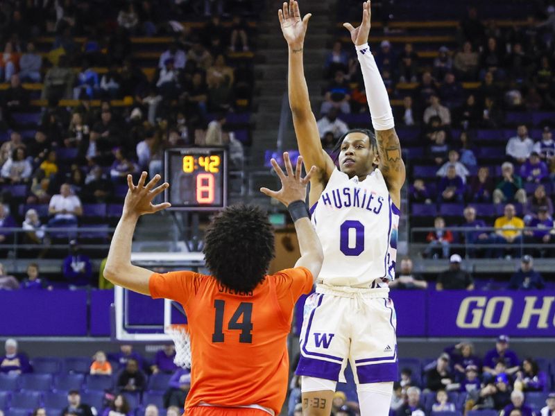 Feb 18, 2023; Seattle, Washington, USA; Washington Huskies guard Koren Johnson (0) shoots a three-pointer against the Oregon State Beavers during the first half at Alaska Airlines Arena at Hec Edmundson Pavilion. Mandatory Credit: Joe Nicholson-USA TODAY Sports