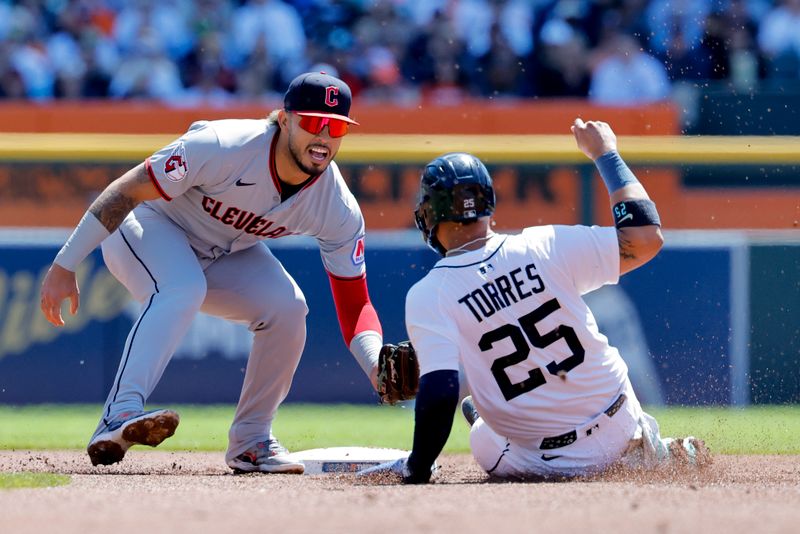 May 25, 2025; Detroit, Michigan, USA;  Cleveland Guardians third base Will Wilson (7) tags Detroit Tigers second base Gleyber Torres (25) out at second in the second inning at Comerica Park. Mandatory Credit: Rick Osentoski-Imagn Images