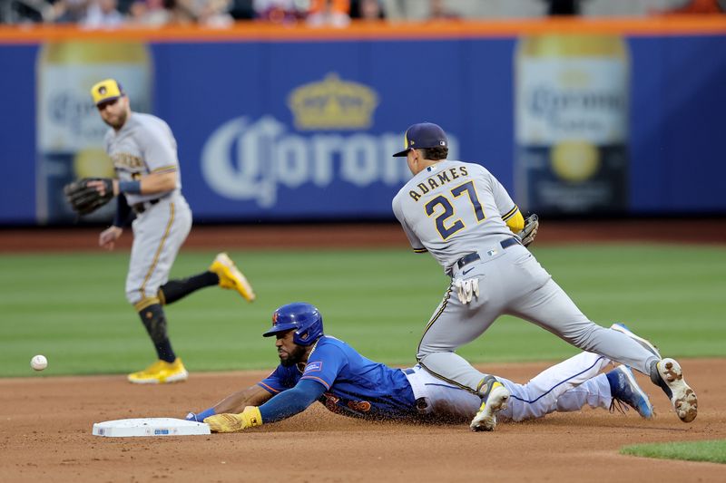 Jun 26, 2023; New York City, New York, USA; New York Mets right fielder Starling Marte (6) steals second base as the throw gets by Milwaukee Brewers shortstop Willy Adames (27) allowing Marte to advance to third during the fourth inning at Citi Field. Mandatory Credit: Brad Penner-USA TODAY Sports