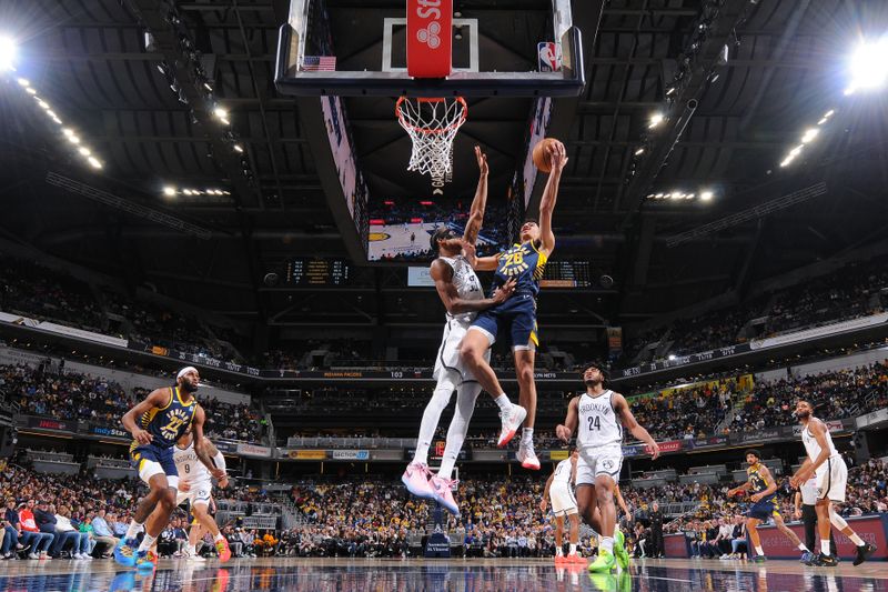 INDIANAPOLIS, IN - APRIL 1: Ben Sheppard #26 of the Indiana Pacers drives to the basket during the game against the Brooklyn Nets on April 1, 2024 at Gainbridge Fieldhouse in Indianapolis, Indiana. NOTE TO USER: User expressly acknowledges and agrees that, by downloading and or using this Photograph, user is consenting to the terms and conditions of the Getty Images License Agreement. Mandatory Copyright Notice: Copyright 2024 NBAE (Photo by Ron Hoskins/NBAE via Getty Images)