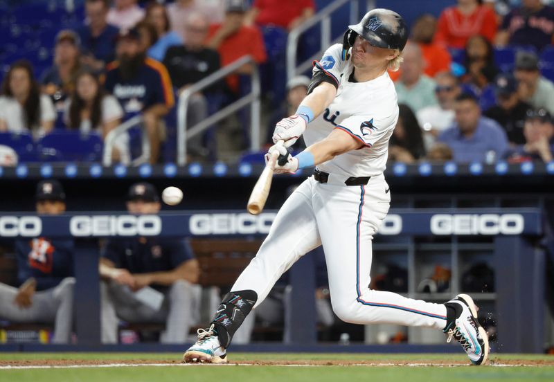 Aug 6, 2025; Miami, Florida, USA; Miami Marlins left fielder Kyle Stowers (28) bats against the Houston Astros during the first inning at loanDepot Park. Mandatory Credit: Rhona Wise-Imagn Images