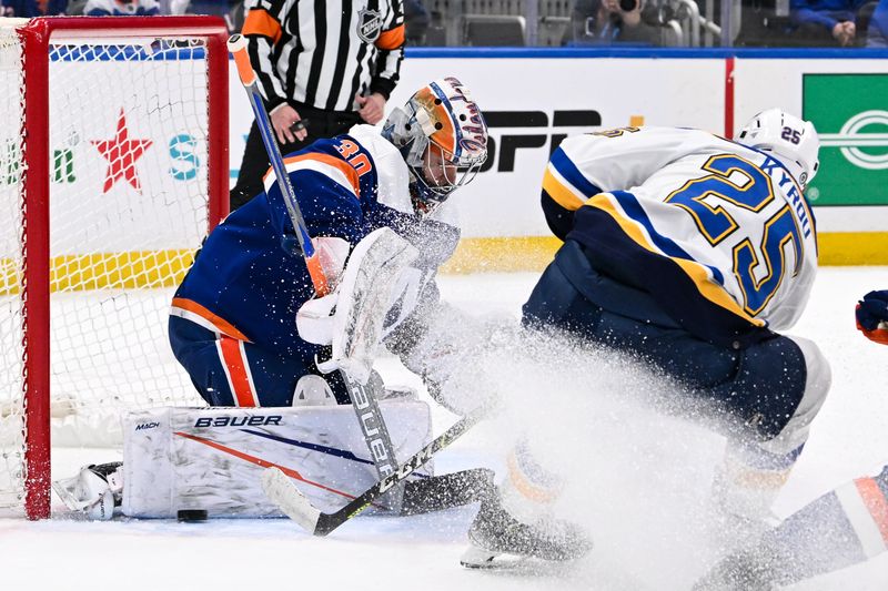 Mar 5, 2024; Elmont, New York, USA;  New York Islanders goaltender Ilya Sorokin (30) makes a save on St. Louis Blues center Jordan Kyrou (25) during the first period at UBS Arena. Mandatory Credit: Dennis Schneidler-USA TODAY Sports