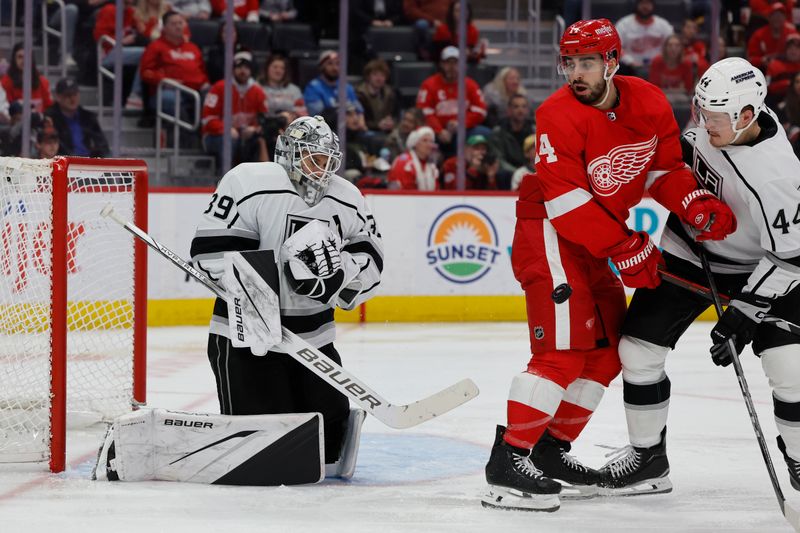 Jan 13, 2024; Detroit, Michigan, USA;  Los Angeles Kings goaltender Cam Talbot (39) makes a save in front of Detroit Red Wings center Robby Fabbri (14) and  defenseman Mikey Anderson (44) in the second period at Little Caesars Arena. Mandatory Credit: Rick Osentoski-USA TODAY Sports