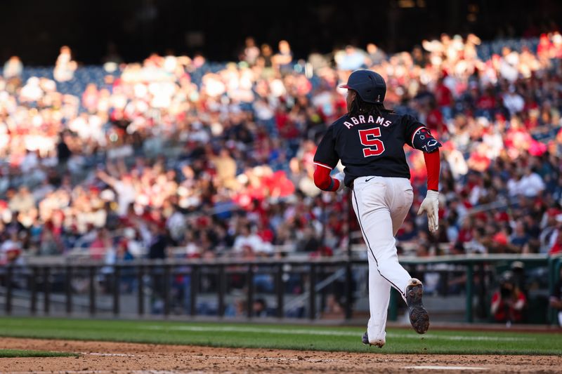 Apr 20, 2024; Washington, District of Columbia, USA; Washington Nationals shortstop CJ Abrams (5) doubles against the Houston Astros during the ninth inning at Nationals Park. Mandatory Credit: Scott Taetsch-USA TODAY Sports