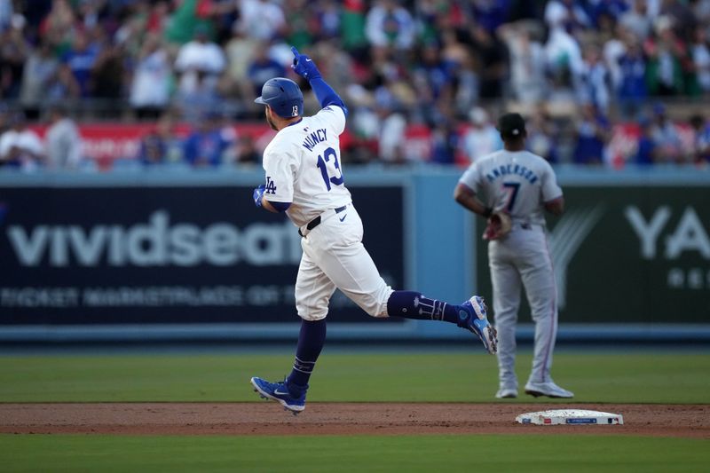 May 7, 2024; Los Angeles, California, USA; Los Angeles Dodgers third baseman Max Muncy (13) runs the bases after hitting a grand slam in the first inning against the Miami Marlins at Dodger Stadium. Mandatory Credit: Kirby Lee-USA TODAY Sports