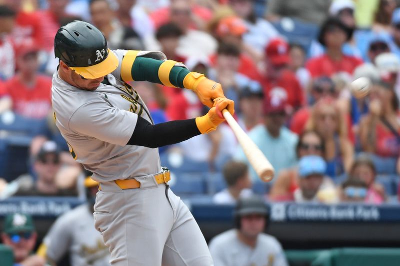 Jul 14, 2024; Philadelphia, Pennsylvania, USA; Oakland Athletics outfielder Brent Rooker (25) hits a two-run home run against the Philadelphia Phillies during the fourth inning at Citizens Bank Park. Mandatory Credit: Eric Hartline-USA TODAY Sports