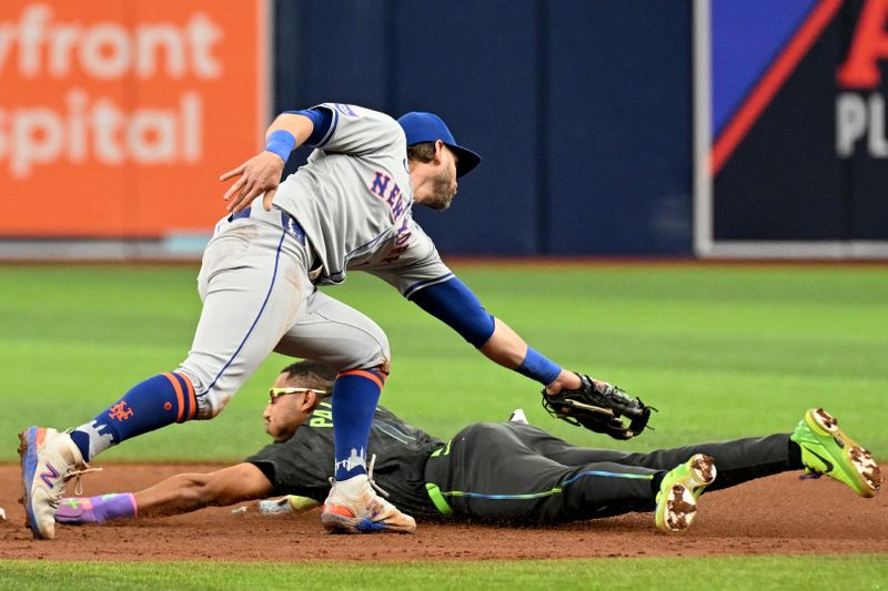 May 5, 2024; St. Petersburg, Florida, USA; Tampa Bay Rays left fielder Richie Palacios (1) slides under the tag of New York Mets second baseman Jeff McNeil (1) in the fourth inning  at Tropicana Field. Mandatory Credit: Jonathan Dyer-USA TODAY Sports