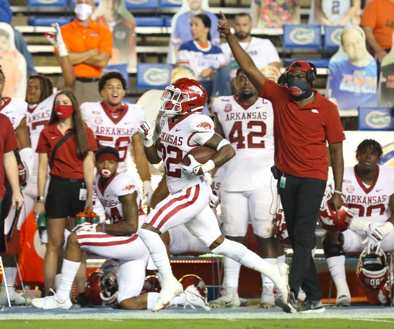 Nov 14, 2020; Gainesville, FL, USA;  Arkansas Razorbacks running back Trelon Smith (22) scores a touchdown during a football game against Florida at Ben Hill Griffin Stadium.  Mandatory Credit: Brad McClenny-USA TODAY NETWORK