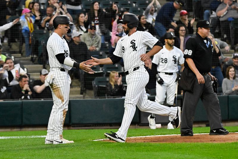 May 10, 2024; Chicago, Illinois, USA;  Chicago White Sox shortstop Paul DeJong (29) high fives catcher Korey Lee (26) after scoring against the Cleveland Guardians during the fifth inning at Guaranteed Rate Field. Mandatory Credit: Matt Marton-USA TODAY Sports