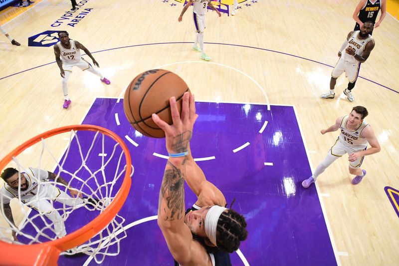 LOS ANGELES, CA - APRIL 27: Aaron Gordon #50 of the Denver Nuggets dunks the ball during the game against the Los Angeles Lakers during Round 1 Game 4 of the 2024 NBA Playoffs on April 27, 2024 at Crypto.Com Arena in Los Angeles, California. NOTE TO USER: User expressly acknowledges and agrees that, by downloading and/or using this Photograph, user is consenting to the terms and conditions of the Getty Images License Agreement. Mandatory Copyright Notice: Copyright 2024 NBAE (Photo by Adam Pantozzi/NBAE via Getty Images)