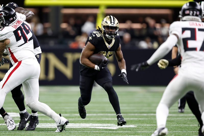 New Orleans Saints running back Kendre Miller (25) runs the ball during an NFL football game against the Atlanta Falcons, Sunday, Jan. 7, 2024, in New Orleans. (AP Photo/Tyler Kaufman)