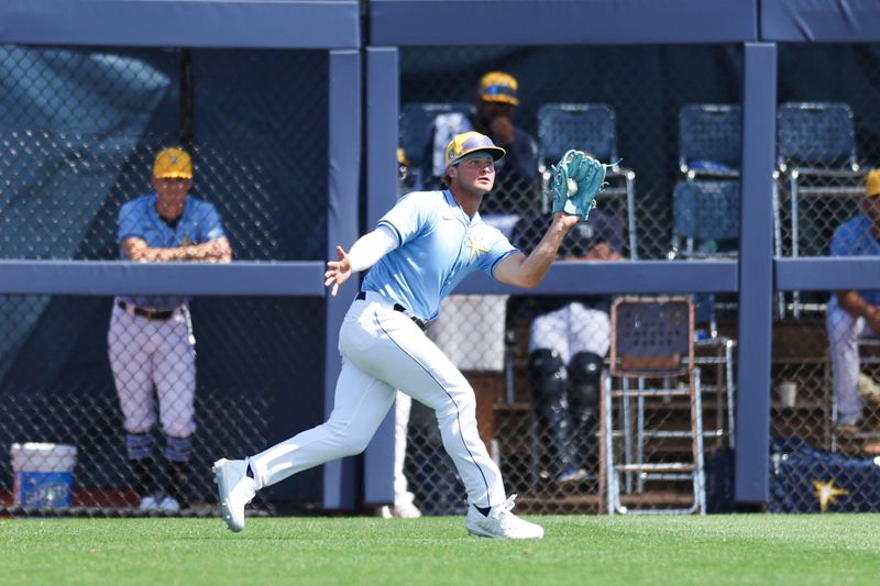 Mar 15, 2024; Port Charlotte, Florida, USA;  Tampa Bay Rays right fielder Ryan Cermak (25) catches a fly ball for an out against the Baltimore Orioles in the seventh inning at Charlotte Sports Park. Mandatory Credit: Nathan Ray Seebeck-USA TODAY Sports