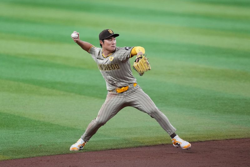 May 5, 2024; Phoenix, Arizona, USA; San Diego Padres shortstop Ha-Seong Kim (7) throws to first base against the Arizona Diamondbacks during the third inning at Chase Field. Mandatory Credit: Joe Camporeale-USA TODAY Sports