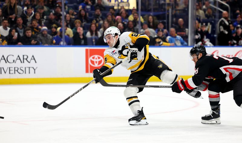 Feb 5, 2026; Buffalo, New York, USA;  Pittsburgh Penguins right wing Avery Hayes (85) takes a shot on goal and scores his first career NHL goal during the first period against the Buffalo Sabres at KeyBank Center. Mandatory Credit: Timothy T. Ludwig-Imagn Images