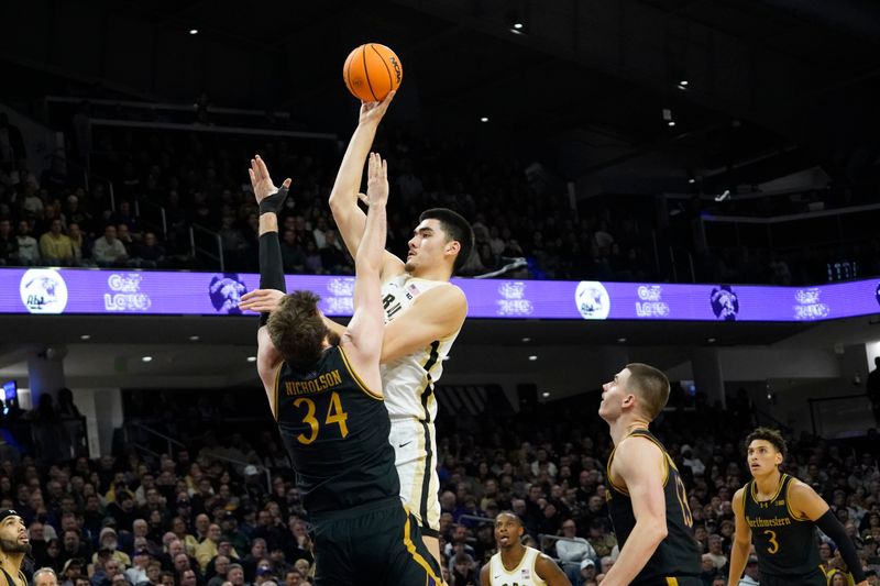 Dec 1, 2023; Evanston, Illinois, USA; Purdue Boilermakers guard Carson Barrett (34) defends Purdue Boilermakers center Zach Edey (15) during the first half at Welsh-Ryan Arena. Mandatory Credit: David Banks-USA TODAY Sports