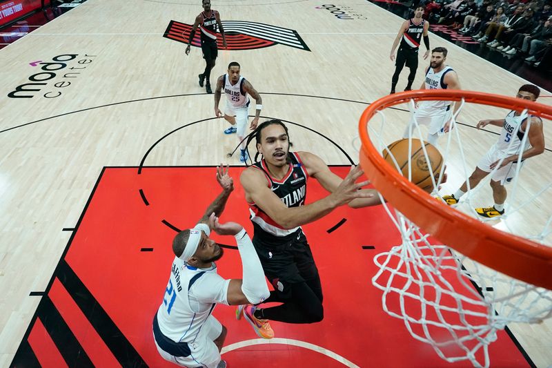 PORTLAND, OREGON - DECEMBER 01: Dalano Banton #5 of the Portland Trail Blazers shoots the ball against Daniel Gafford #21 of the Dallas Mavericks during the first half at Moda Center on December 01, 2024 in Portland, Oregon. NOTE TO USER: User expressly acknowledges and agrees that, by downloading and or using this photograph, User is consenting to the terms and conditions of the Getty Images License Agreement. (Photo by Soobum Im/Getty Images)