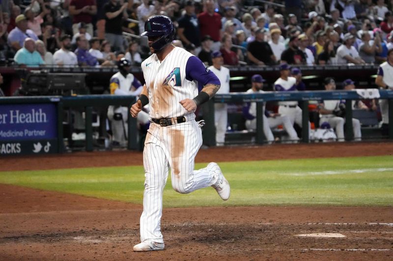 Aug 13, 2023; Phoenix, Arizona, USA; Arizona Diamondbacks first baseman Christian Walker (53) scores a run against the San Diego Padres during the eighth inning at Chase Field. Mandatory Credit: Joe Camporeale-USA TODAY Sports