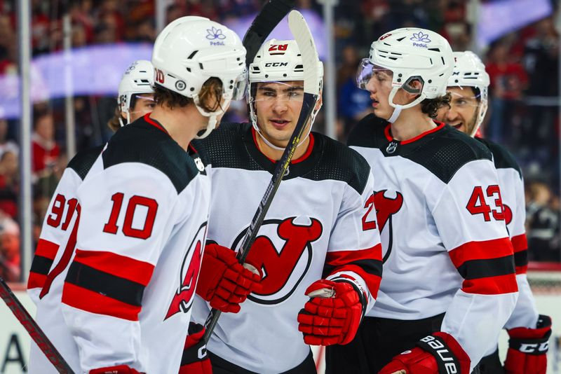 Dec 9, 2023; Calgary, Alberta, CAN; New Jersey Devils right wing Timo Meier (28) celebrates his goal with teammates against the Calgary Flames during the third period at Scotiabank Saddledome. Mandatory Credit: Sergei Belski-USA TODAY Sports