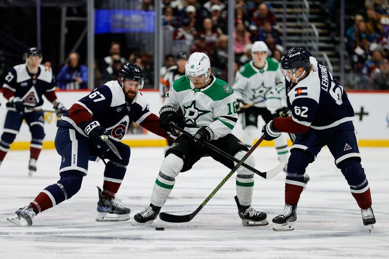 Jan 18, 2025; Denver, Colorado, USA; Dallas Stars center Sam Steel (18) battles for the puck with Colorado Avalanche defenseman Keaton Middleton (67) and left wing Artturi Lehkonen (62) in the first period at Ball Arena. Mandatory Credit: Isaiah J. Downing-Imagn Images