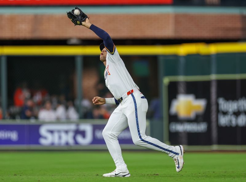 May 12, 2025; Houston, Texas, USA; Houston Astros right fielder Cam Smith (11) catches Kansas City Royals shortstop Maikel Garcia (11) (not pictured) fly ball for an out in the sixth inning at Daikin Park. Mandatory Credit: Thomas Shea-Imagn Images