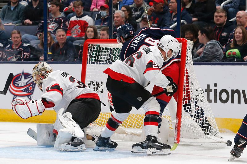 Mar 14, 2024; Columbus, Ohio, USA; Columbus Blue Jackets center Boone Jenner (38) and Ottawa Senators defenseman Erik Brannstrom (26) crash into the net during the first period at Nationwide Arena. Mandatory Credit: Russell LaBounty-USA TODAY Sports