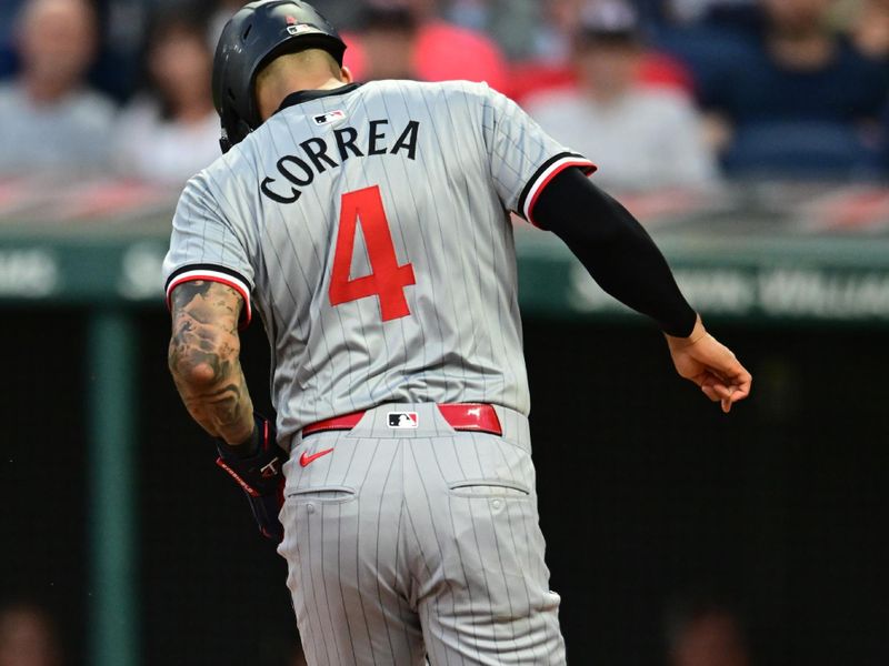 Sep 16, 2024; Cleveland, Ohio, USA; Minnesota Twins shortstop Carlos Correa (4) scores on a passed ball during the third inning against the Cleveland Guardians at Progressive Field. Mandatory Credit: Ken Blaze-Imagn Images