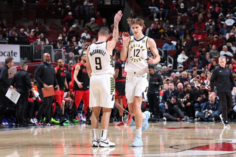 CHICAGO, IL - DECEMBER 6: T.J. McConnell #9 and Johnny Furphy #12 of the Indiana Pacers high five during the game against the Chicago Bulls on December 6, 2024 at United Center in Chicago, Illinois. NOTE TO USER: User expressly acknowledges and agrees that, by downloading and or using this photograph, User is consenting to the terms and conditions of the Getty Images License Agreement. Mandatory Copyright Notice: Copyright 2024 NBAE (Photo by Jeff Haynes/NBAE via Getty Images)