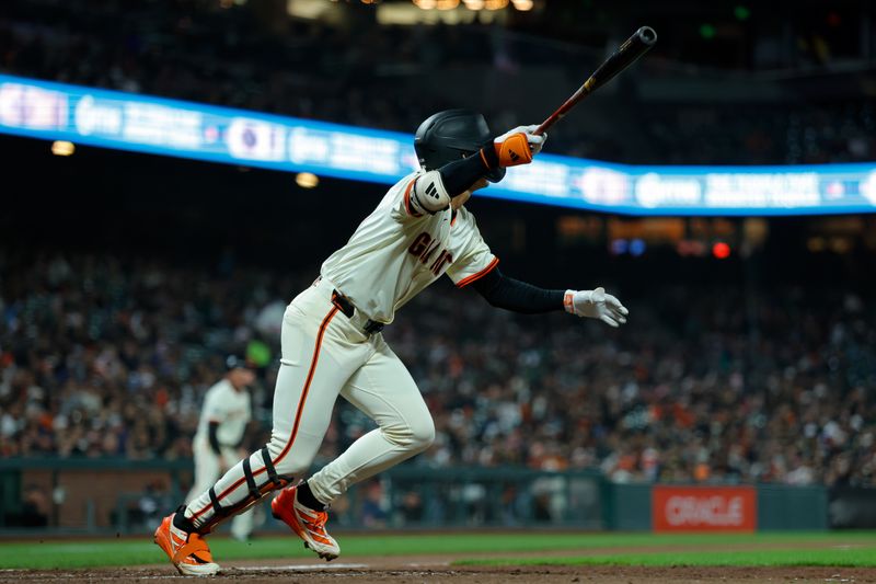Apr 21, 2025; San Francisco, California, USA; San Francisco Giants center fielder Jung Hoo Lee (51) hits an RBI triple during the seventh inning against the Milwaukee Brewers at Oracle Park. Mandatory Credit: Sergio Estrada-Imagn Images
