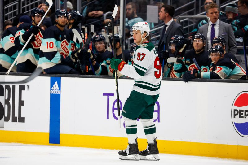 Feb 24, 2024; Seattle, Washington, USA; Minnesota Wild left wing Kirill Kaprizov (97) celebrates while skating past the Seattle Kraken bench after scoring a goal during the second period at Climate Pledge Arena. Mandatory Credit: Joe Nicholson-USA TODAY Sports