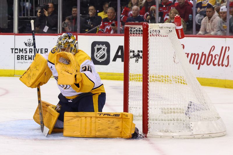 Nov 25, 2024; Newark, New Jersey, USA; New Jersey Devils center Nico Hischier (13) (not shown) scores a goal on Nashville Predators goaltender Juuse Saros (74) during the second period at Prudential Center. Mandatory Credit: Ed Mulholland-Imagn Images