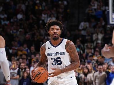 DENVER, CO - DECEMBER 28: Marcus Smart #36 of the Memphis Grizzlies handles the ball during the game against the Denver Nuggets on December 28, 2023 at the Ball Arena in Denver, Colorado. NOTE TO USER: User expressly acknowledges and agrees that, by downloading and/or using this Photograph, user is consenting to the terms and conditions of the Getty Images License Agreement. Mandatory Copyright Notice: Copyright 2023 NBAE (Photo by Garrett Ellwood/NBAE via Getty Images)