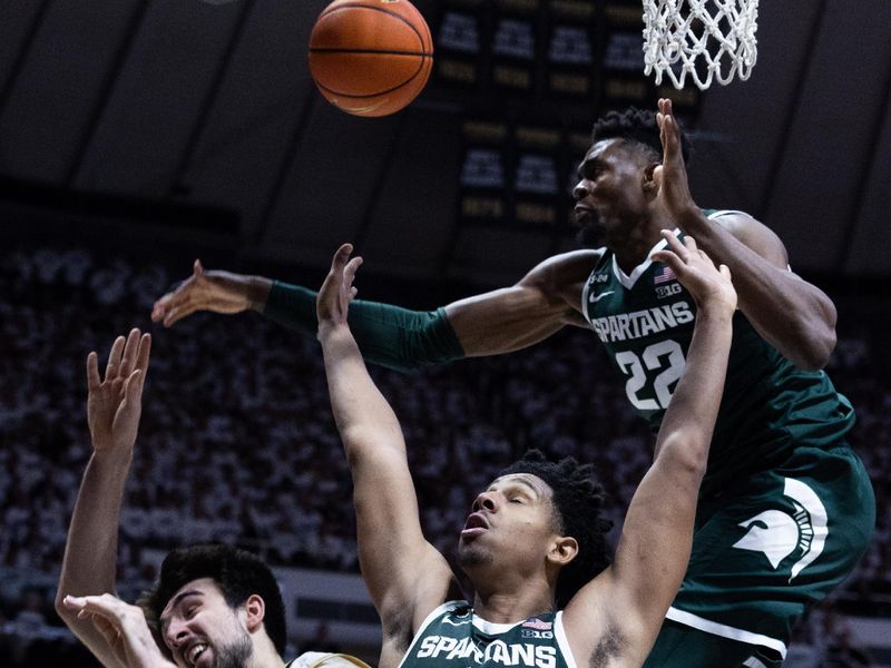 Jan 29, 2023; West Lafayette, Indiana, USA; Purdue Boilermakers guard Ethan Morton (25) shoots the ball while Michigan State Spartans center Mady Sissoko (22) and guard A.J. Hoggard (11) defend in the second half at Mackey Arena. Mandatory Credit: Trevor Ruszkowski-USA TODAY Sports